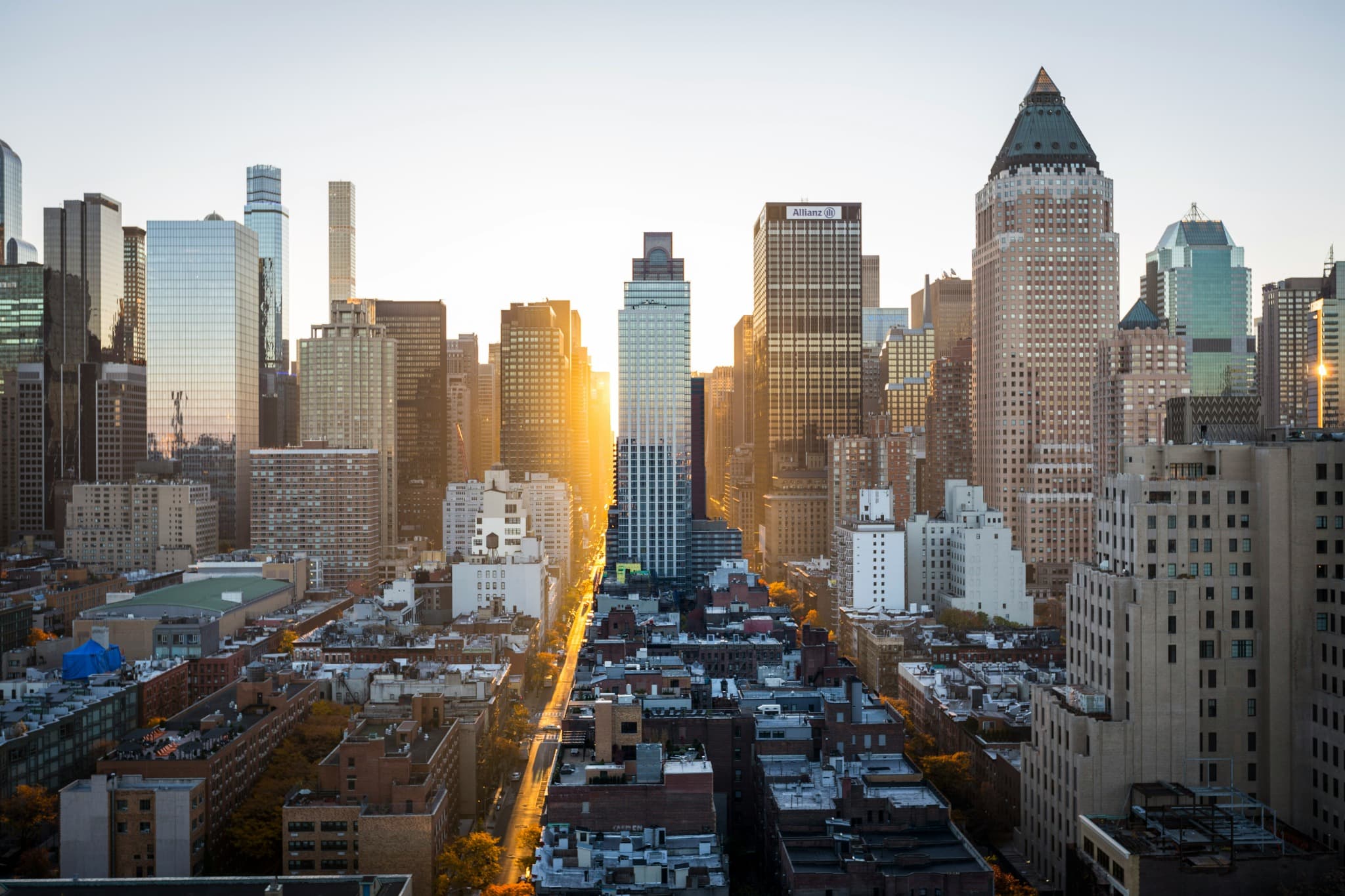 High-rise city buildings with sunlight falling between them