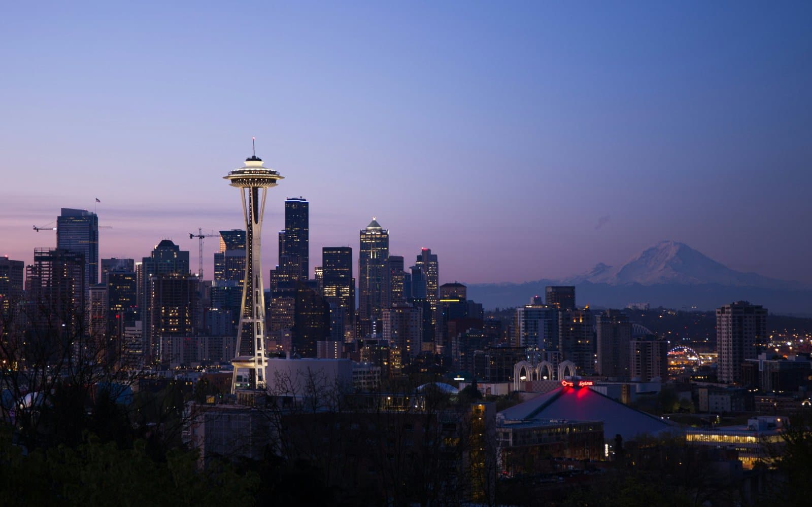 Seattle skyline at dusk with the Space Needle and Mount Rainier